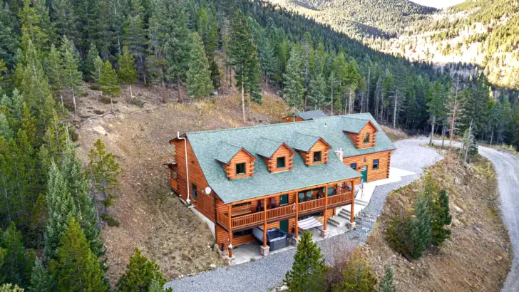 Discover The Tranquility Of Mountain Living In This Charming Log Cabin