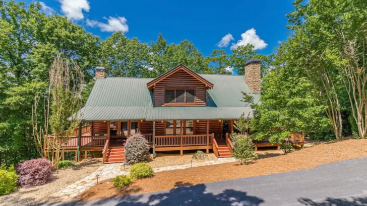 Charming Log Cabin Nestled Amidst Lush Greenery And Breathtaking Mountain Views