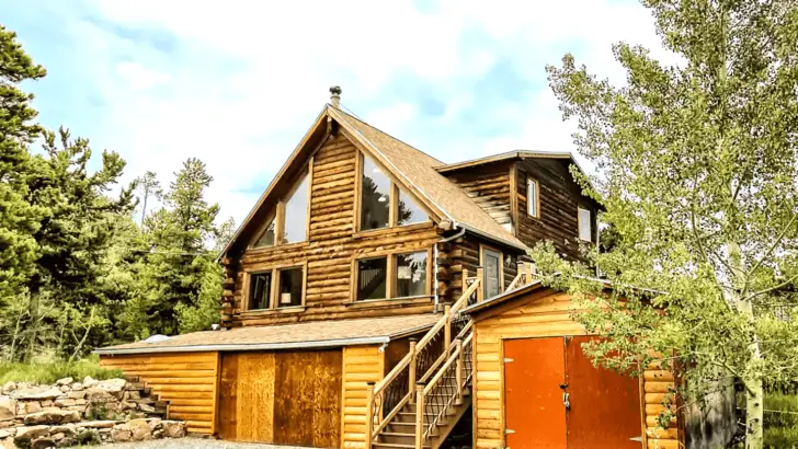 Let The Stress Melt Away In This Tranquil Log Cabin Oasis