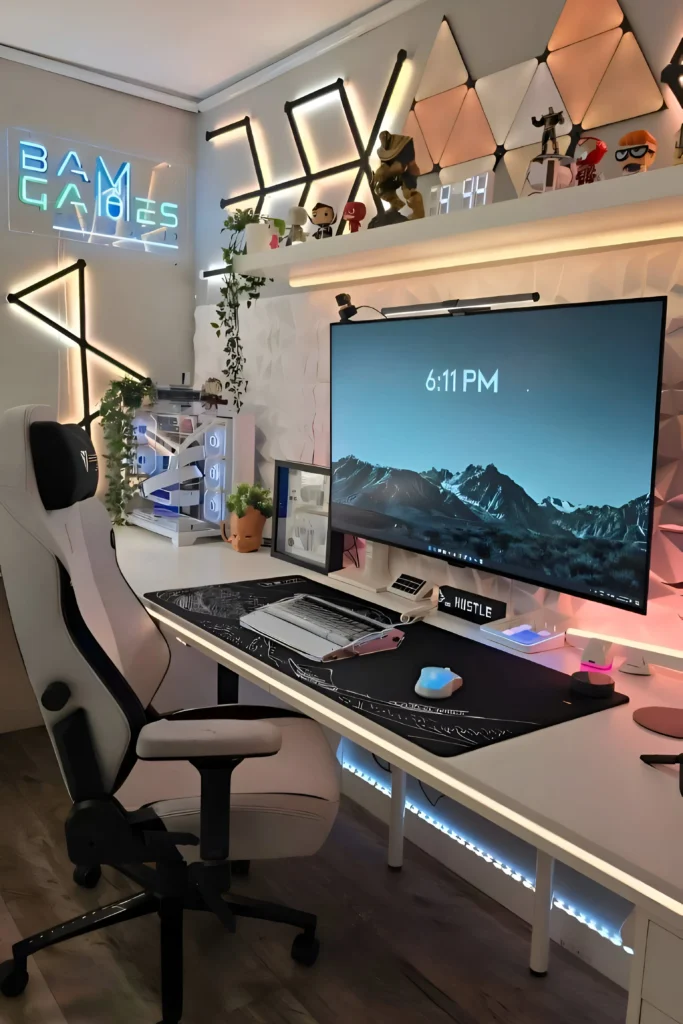 Stylish gaming desk setup with RGB lighting, white gaming chair, ultrawide monitor, and custom-built PC with LED accents.