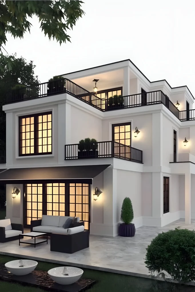 Luxury urban home with a white facade, multiple balconies, wrought-iron railings, a softly lit patio, and modern water features.