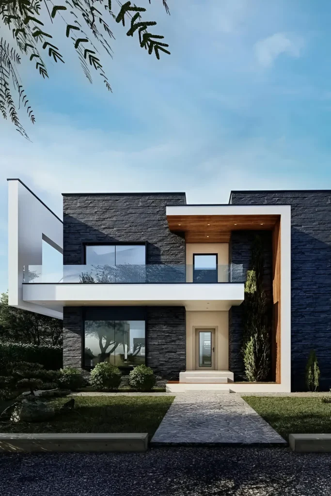 Modern house with a black stone facade, white framing, wooden accents, glass balcony, and minimalist landscaping.