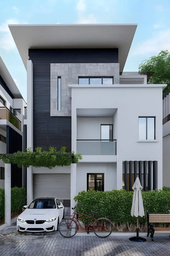 Modern urban home with white walls, stone texture, and vertical slats, featuring greenery and a rooftop overhang. A chic blend of minimalistic design and natural elements.