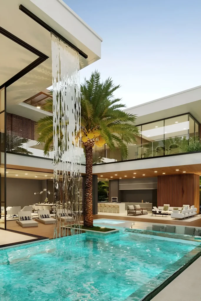 Luxurious modern villa with a cascading waterfall into a turquoise pool, surrounded by lounge seating, a dining area, and tropical palm trees.