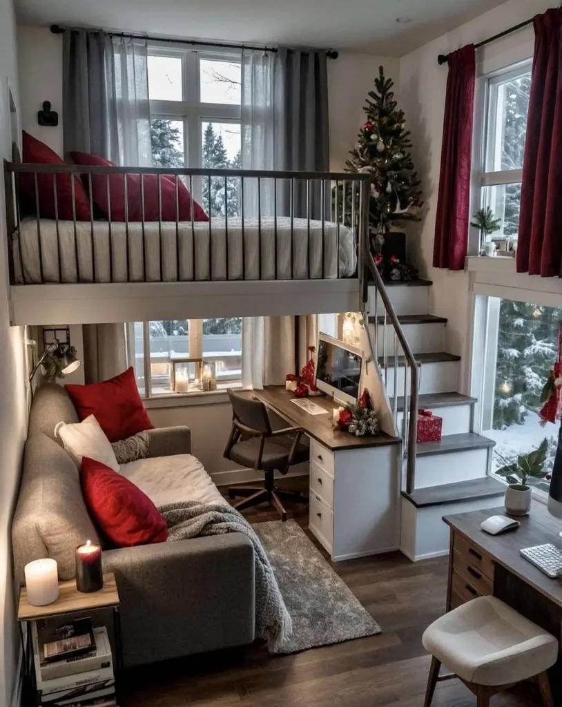 Tiny house interior with red pillows, curtains, and a desk area.