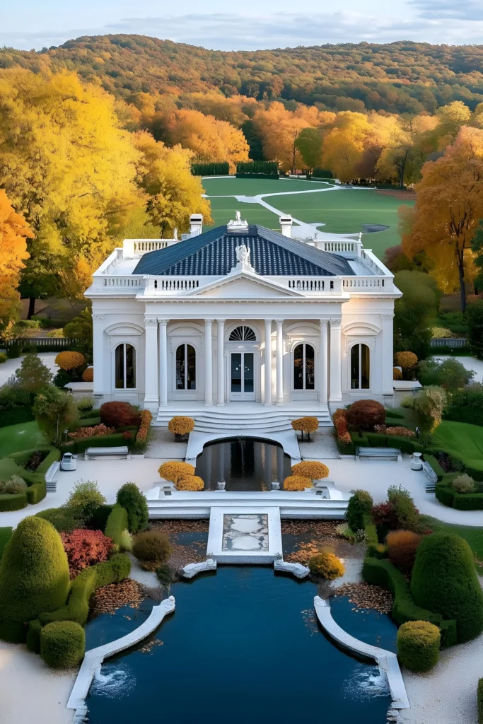 Neoclassical mansion surrounded by autumn foliage, reflective ponds, manicured gardens, and a golden-hued landscape.