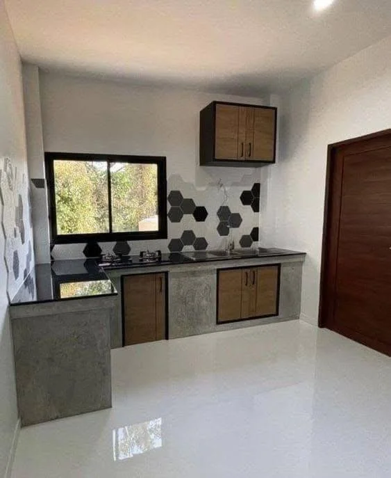 Kitchen featuring a highly polished concrete countertop with a contrasting textured base. - concrete kitchen ideas