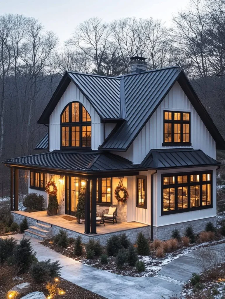 Farmhouse cottage with high-contrast white siding and dark trim.