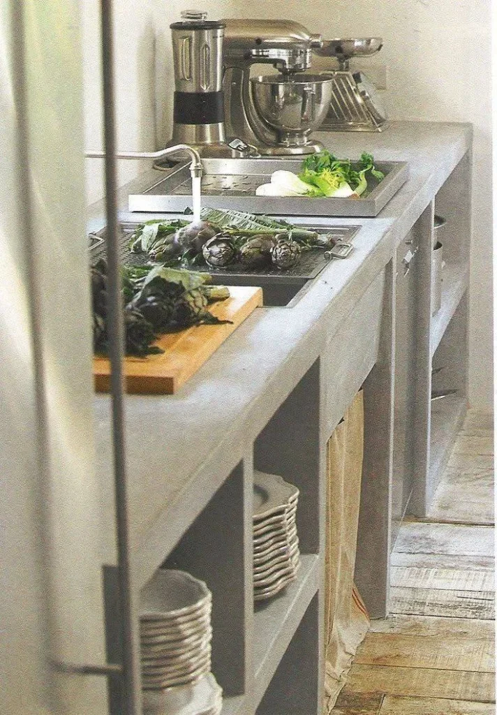 Kitchen featuring an integrated concrete sink and countertop, highlighting minimalist design.

