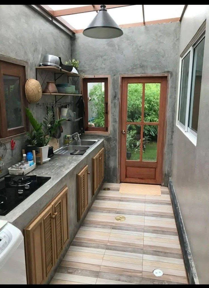 Kitchen with concrete walls and countertops for a cohesive, modern look.