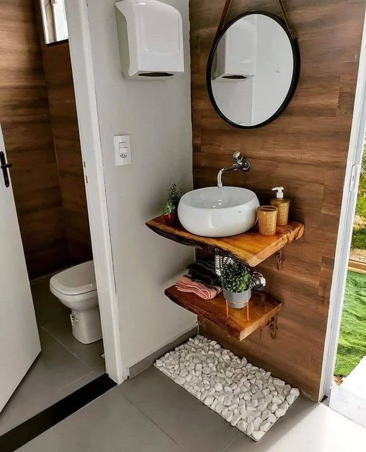 DIY rustic floating shelves in bathroom for towel and toiletry organization.