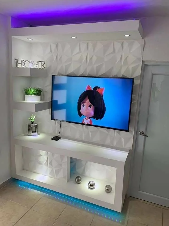 Modern TV wall unit with built-in shelves and accent lighting. DIY Home Organization