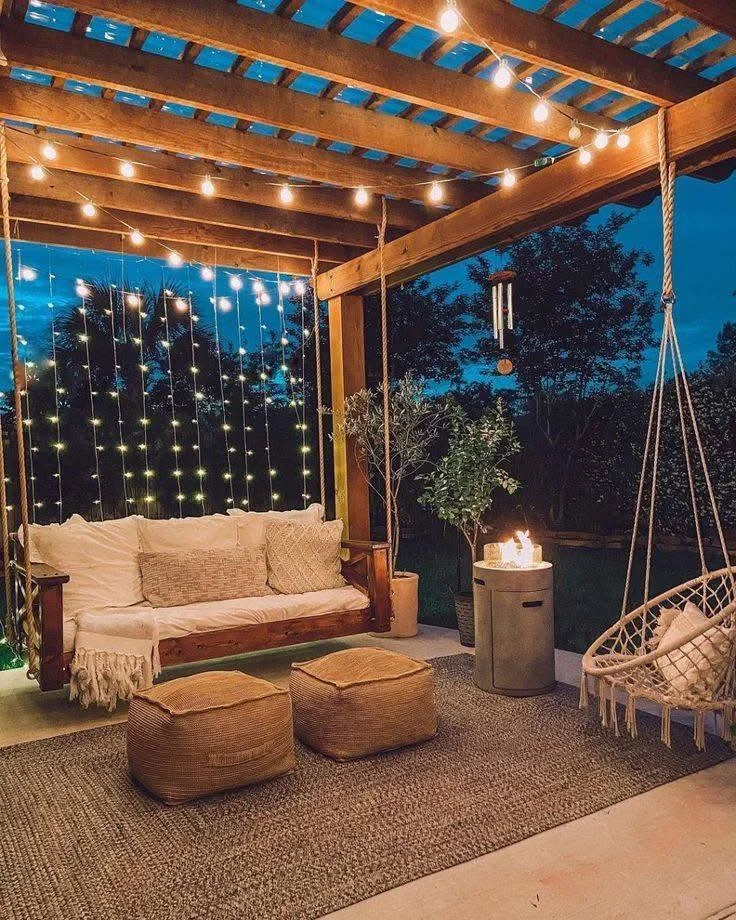 Cozy patio with string lights, hanging chairs, and comfortable seating. DIY Home Organization