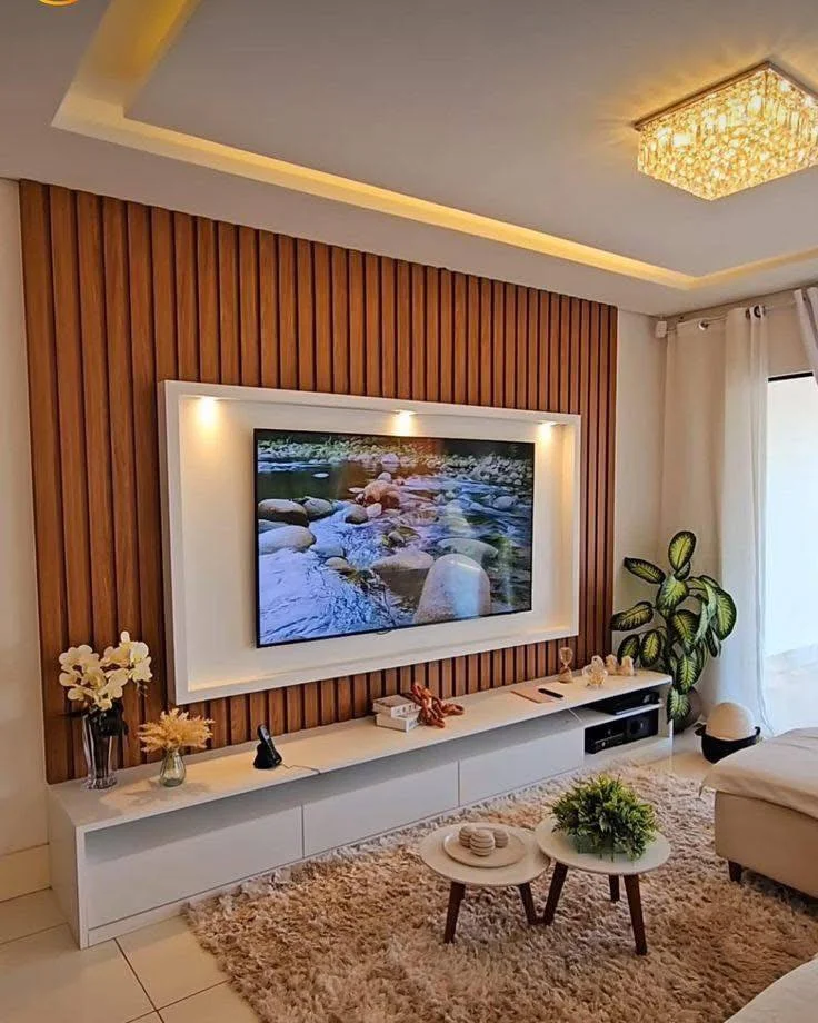 Living room TV feature wall with wood paneling and built-in storage. DIY Home Organization