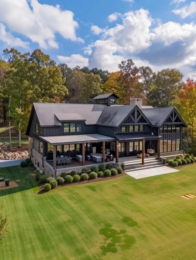 Modern farmhouse with dark exterior and stone accents