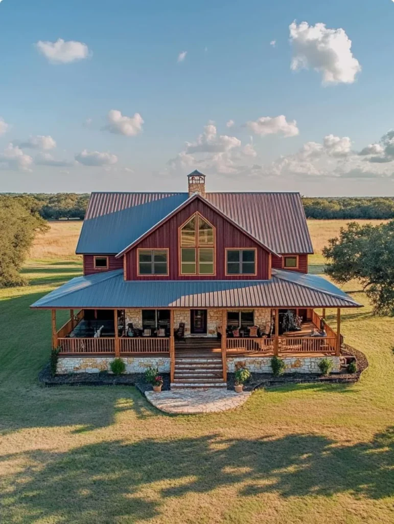 Farmhouse with large porch, gabled roof, and stone accents.