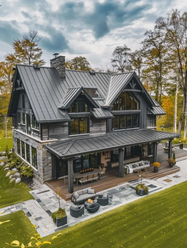 Modern mountain farmhouse with exposed beams and large porch.