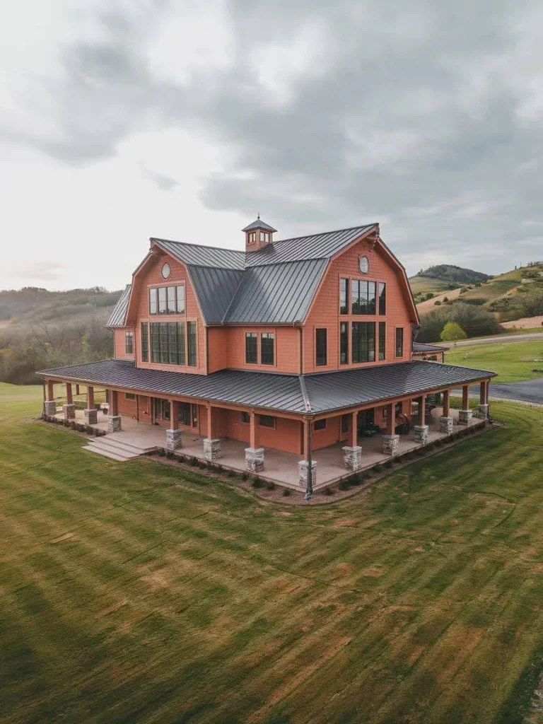 Modern Barndominium Exterior with warm-toned siding, a metal roof, and a hilltop setting.