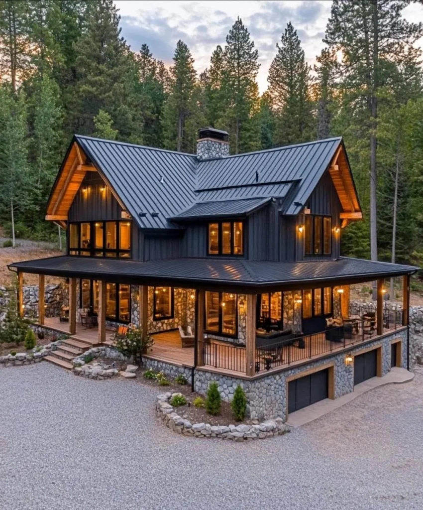 Modern Barndominium Exterior with dark siding and a metal roof, surrounded by trees.