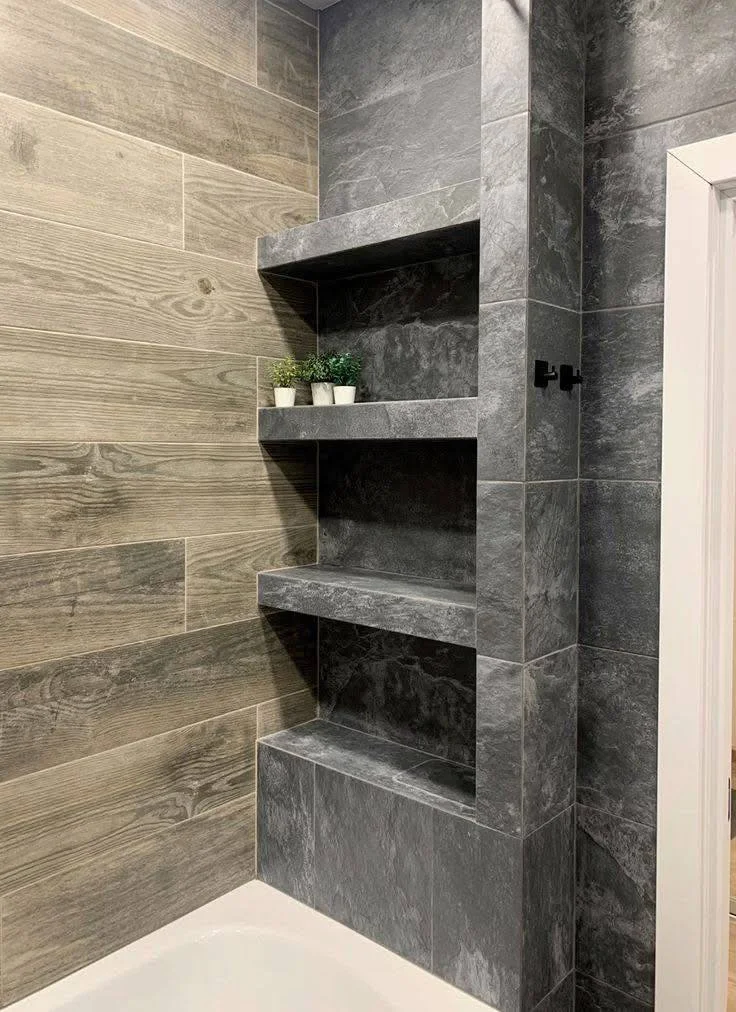 Modern bathroom with wood-look horizontal tiles and dark vertical tile shelving.