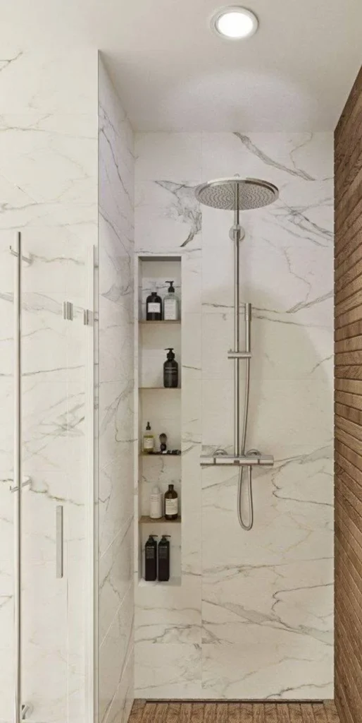 Modern bathroom with large-format marble-look porcelain wall tiles.