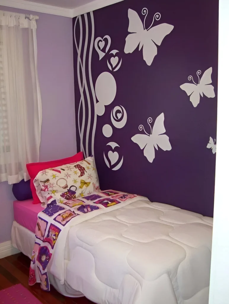 Bedroom with a dark purple accent wall featuring large white butterfly and abstract shape decals.