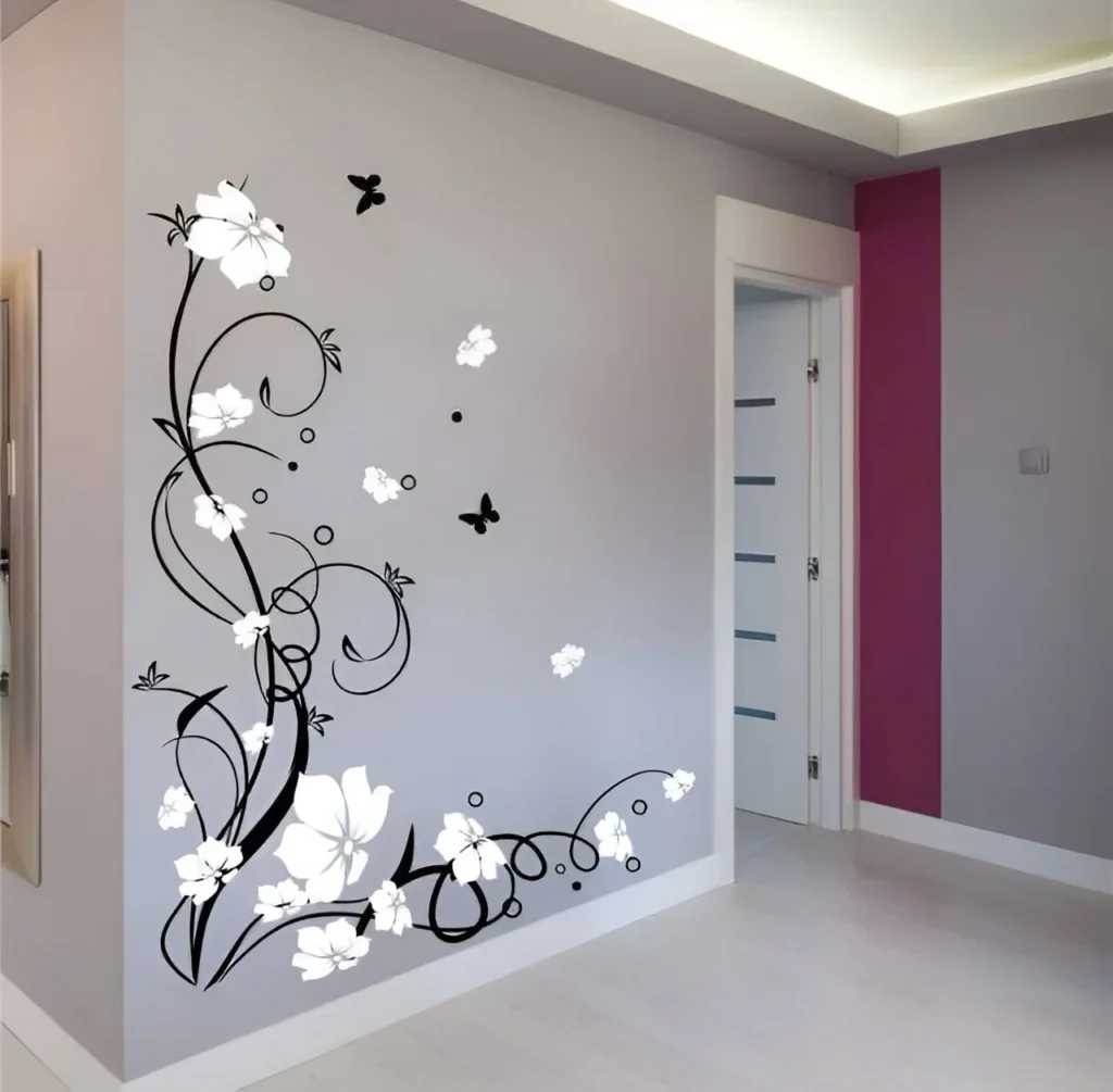 Bedroom wall with a large black and white floral and butterfly wall decal.