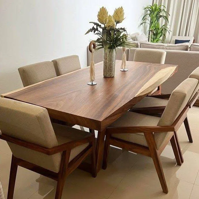 Dining room showcasing a stunning live-edge table with comfortable, neutral-toned chairs.