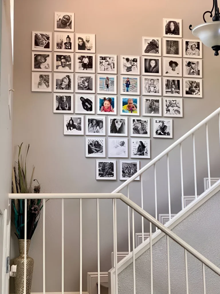 Heart-shaped DIY gallery wall with family photos, ideal for small spaces.