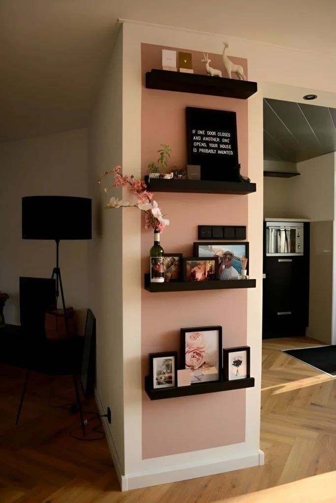 Corner gallery wall with floating shelves and text art for small spaces.