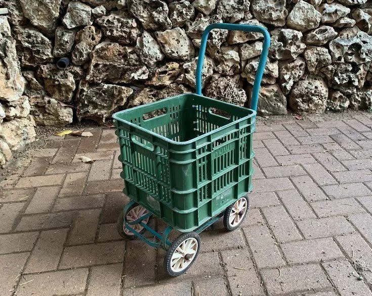 DIY rolling storage cart using a plastic crate and wheels.