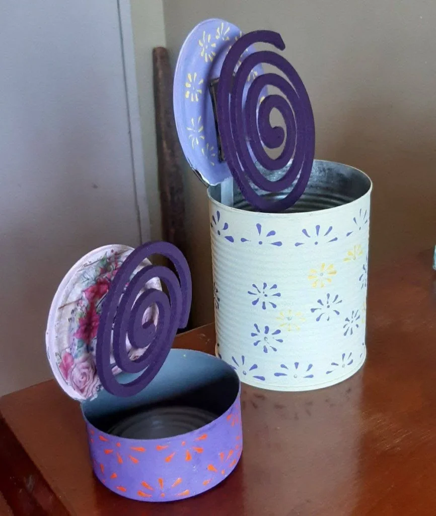 DIY mosquito coil holder made from upcycled tin cans.