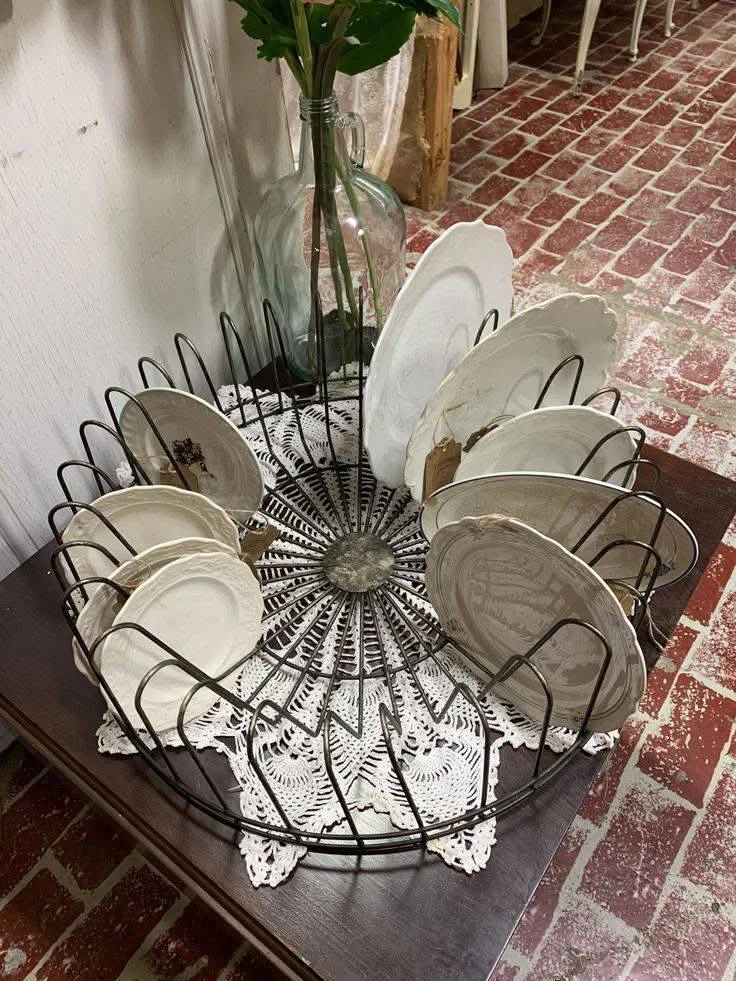 Vintage plate rack for decorative and functional kitchen organization.