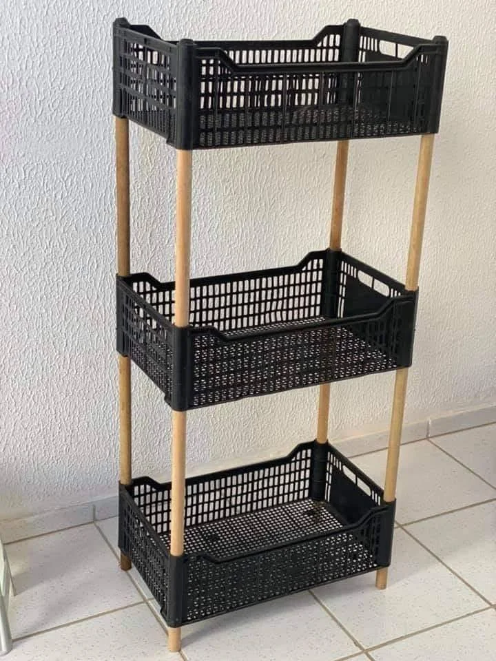 DIY shelving unit with plastic crates for customizable home storage.