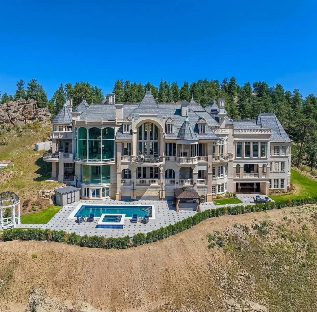 Luxury dream home exterior with castle-inspired architecture and pool.