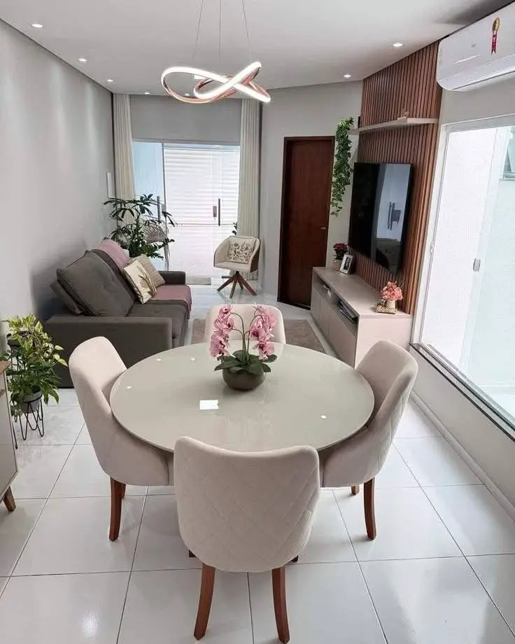 Modern dining room with round table and neutral chairs