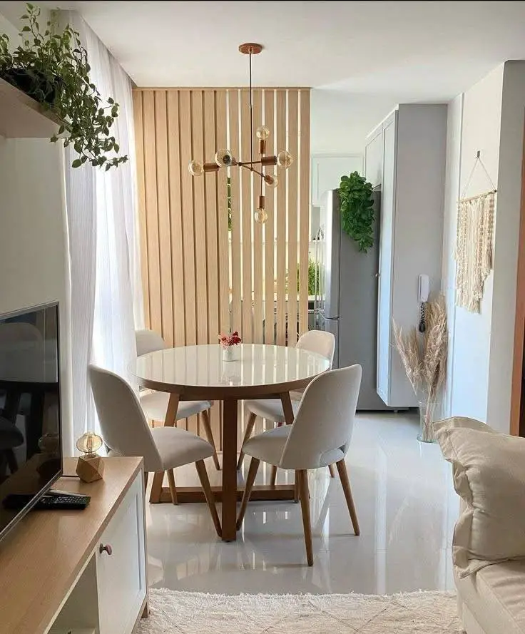 Modern dining room with slatted wood partition.