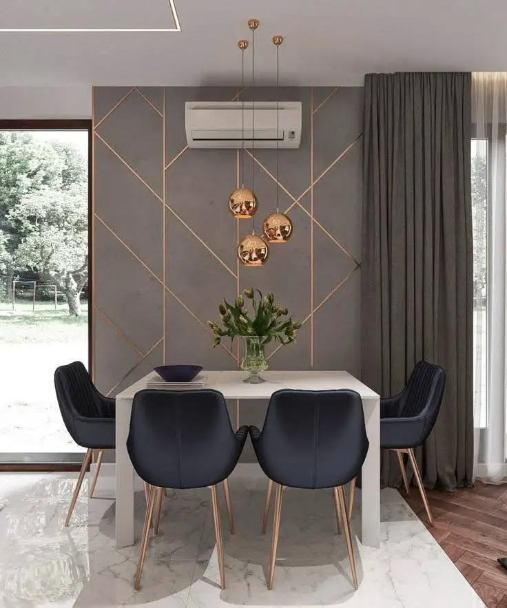 Modern dining room with metallic accents and textured wall.