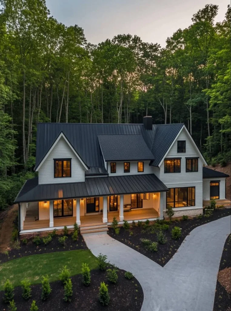 Exterior view of modern farmhouse with contrasting dark roof and white siding.