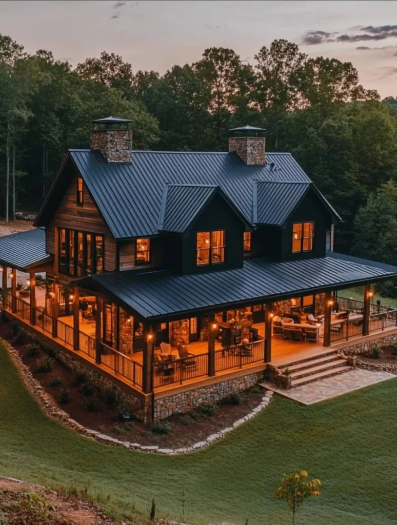 Small, simple modern farmhouse with stone chimney and covered porch.