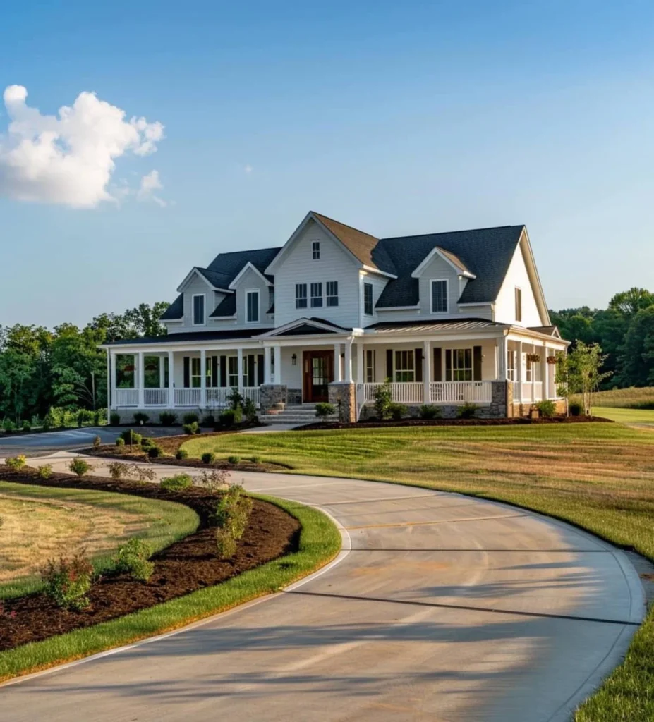 Two-story modern farmhouse with a wraparound porch and curved driveway.