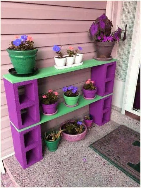 Recycled concrete blocks and wood planks create a colorful plant shelf.