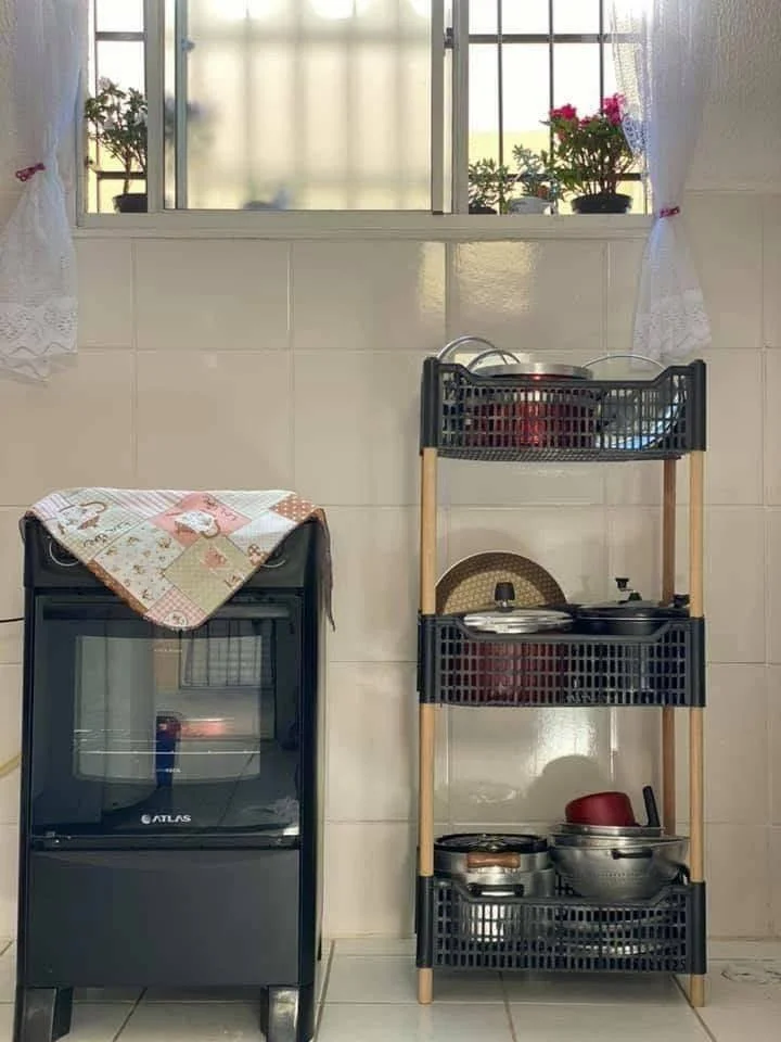 Recycled plastic crates transformed into kitchen shelving.