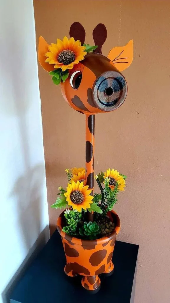 Recycled plastic containers crafted and painted to create a giraffe planter.