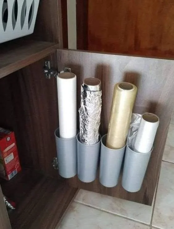 Recycled PVC pipe sections used as dispensers for kitchen wraps. creative recycling Ideas