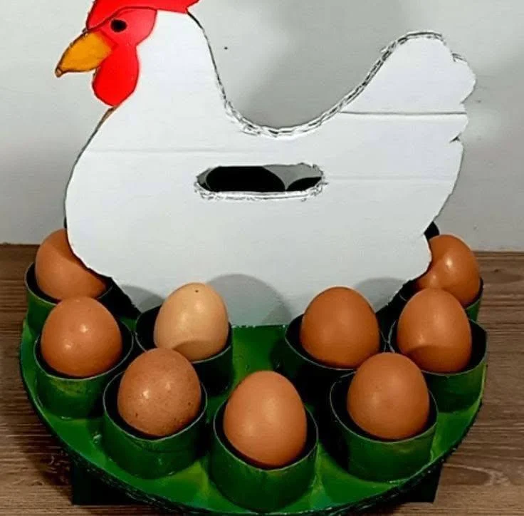 Recycled egg carton crafted into a hen-shaped egg holder.