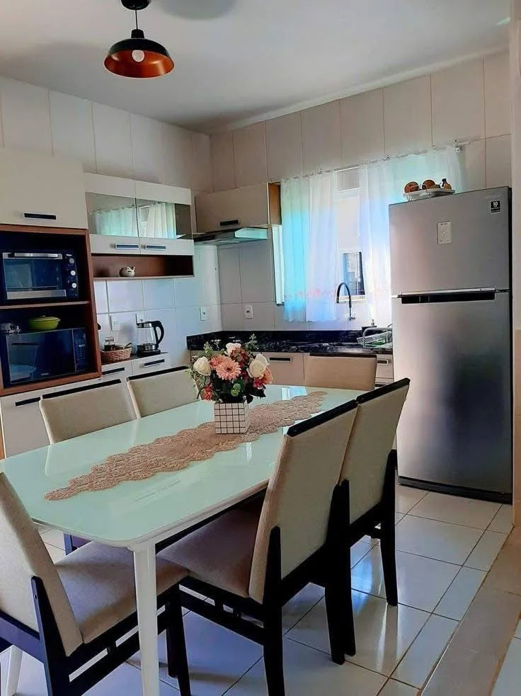 Small home organization idea featuring integrated storage solutions in a kitchen and dining area.