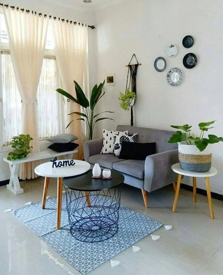 Small home organization idea featuring nesting tables in a small living room.