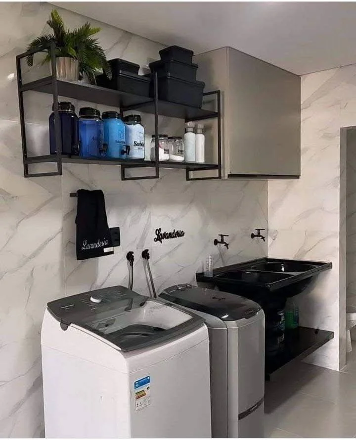 Small home organization idea featuring industrial-style open shelving in a laundry room.