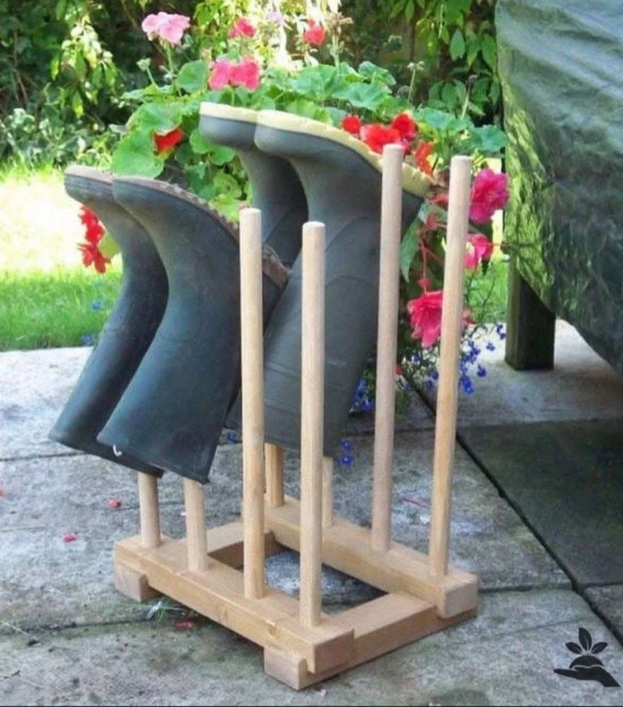 Wooden boot rack holding multiple pairs of boots upside down, promoting drying and organization.